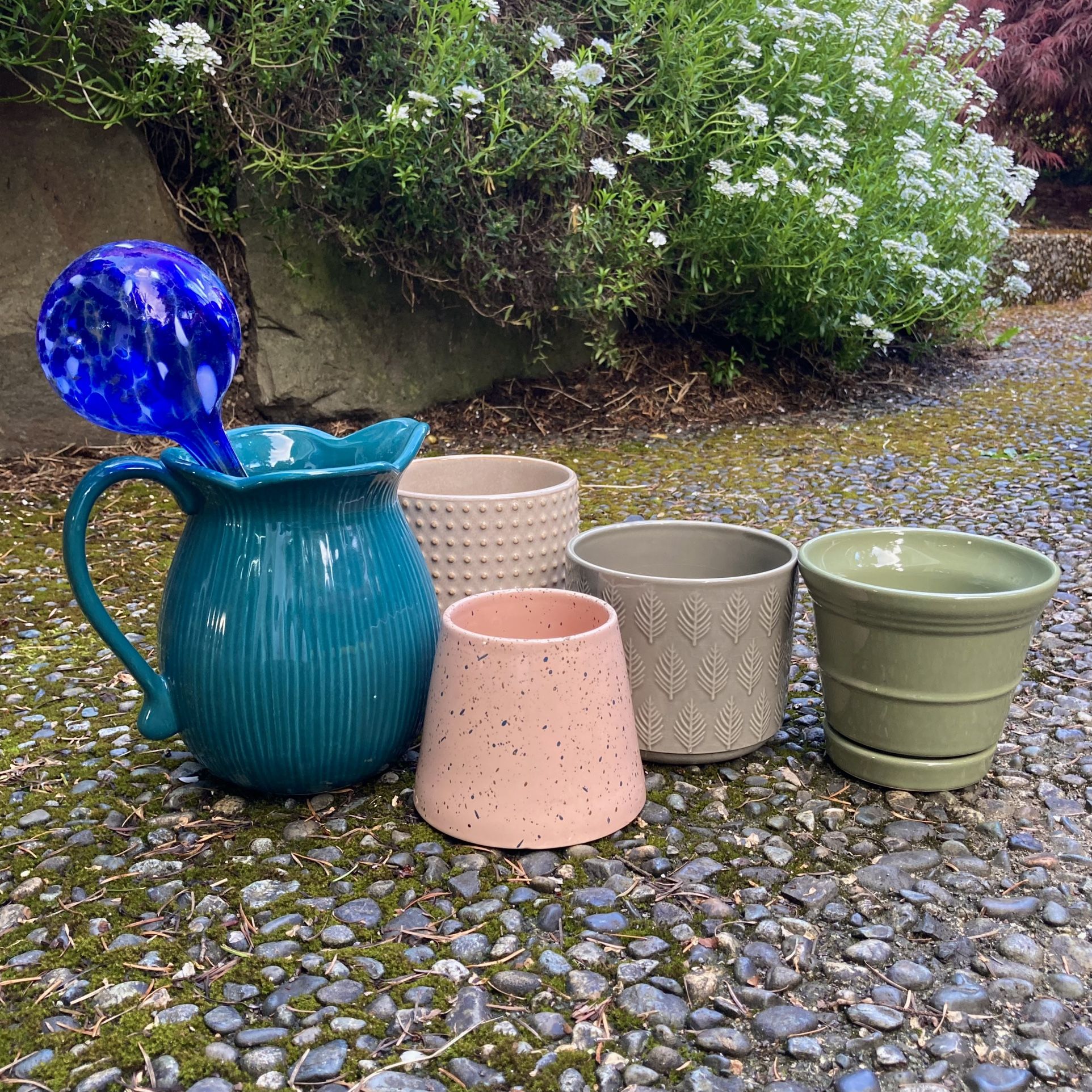 Bundle of garden decor and ceramic pots for plants