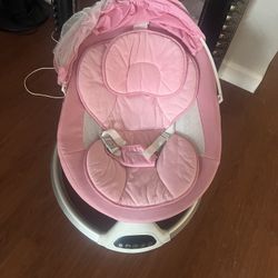 Harppa baby swing. Has multiple swinging motions, blue tooth capability and built in music.