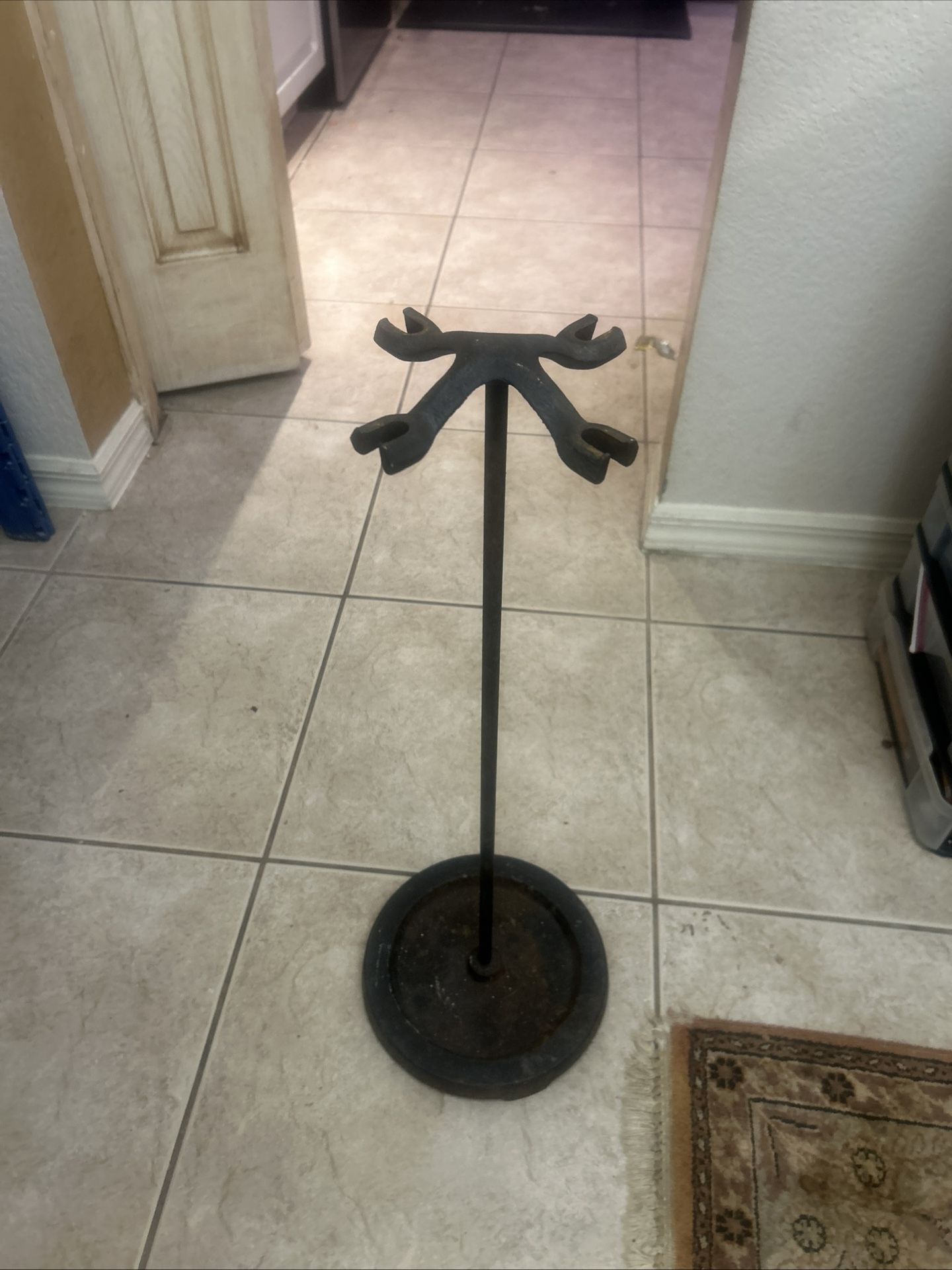 Antique iron holder for fireplace tools