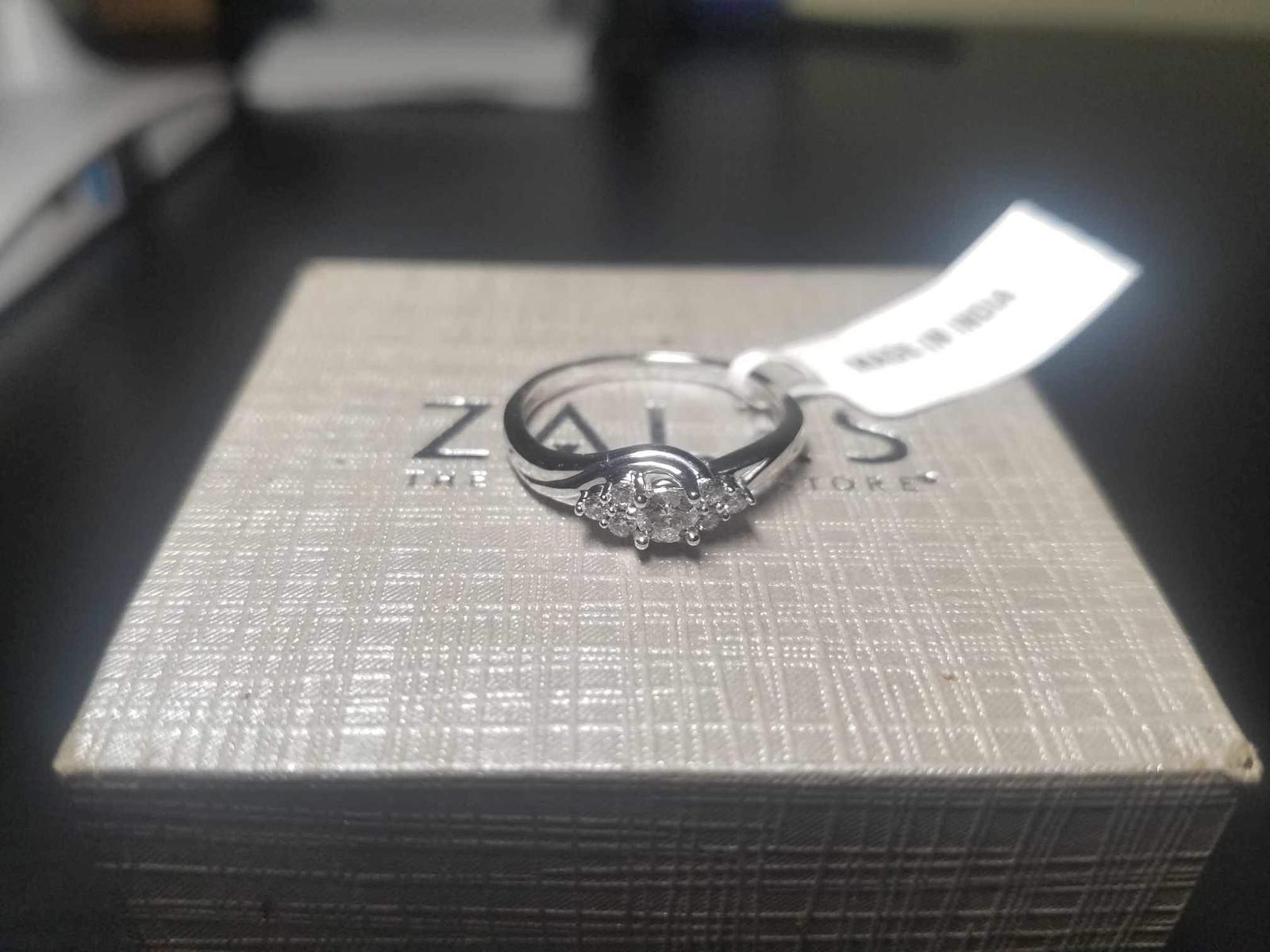 1/3 CT. T.W. Diamond Engagement Ring in 10K White Gold. New, Never Wore. Size 8. Bought From Zales.
