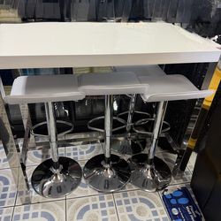 White and chrome table and chairs