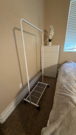 White Rolling Clothes Rack with Bottom Shelf