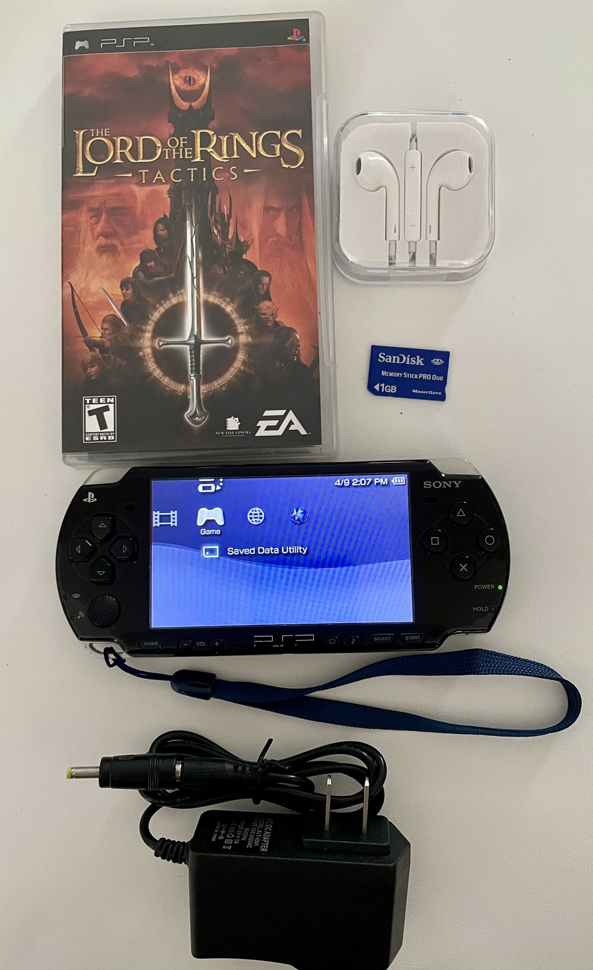 Sony PSP 2001 Bundle Charger, Game, Earbuds, Memory And Wrist Strap Included