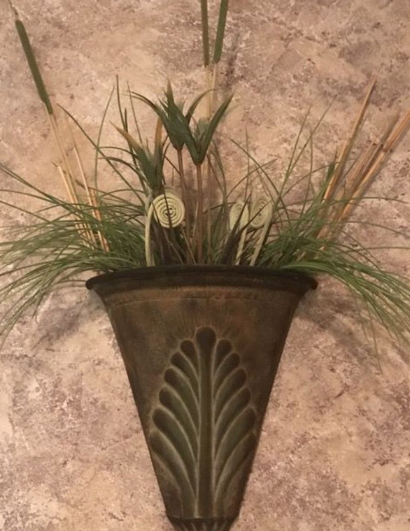 Cone shaped plant holder include plant foliage