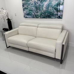 Atlas White Leather/Vinyl Power Reclining Sofa Loveseat Excellent Condition. Adjustable Headrest / Footrest. Dimensions: 63W x 33H x 43.5L. Was $2,400
