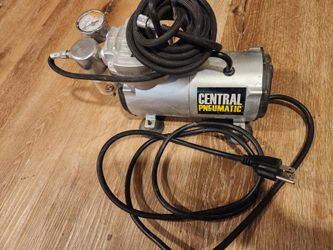 The Central Pneumatic 1/5 HP 58 PSI Oil-Free Airbrush Compressor