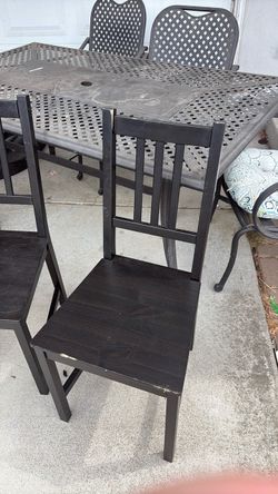 Set of black wood chairs
