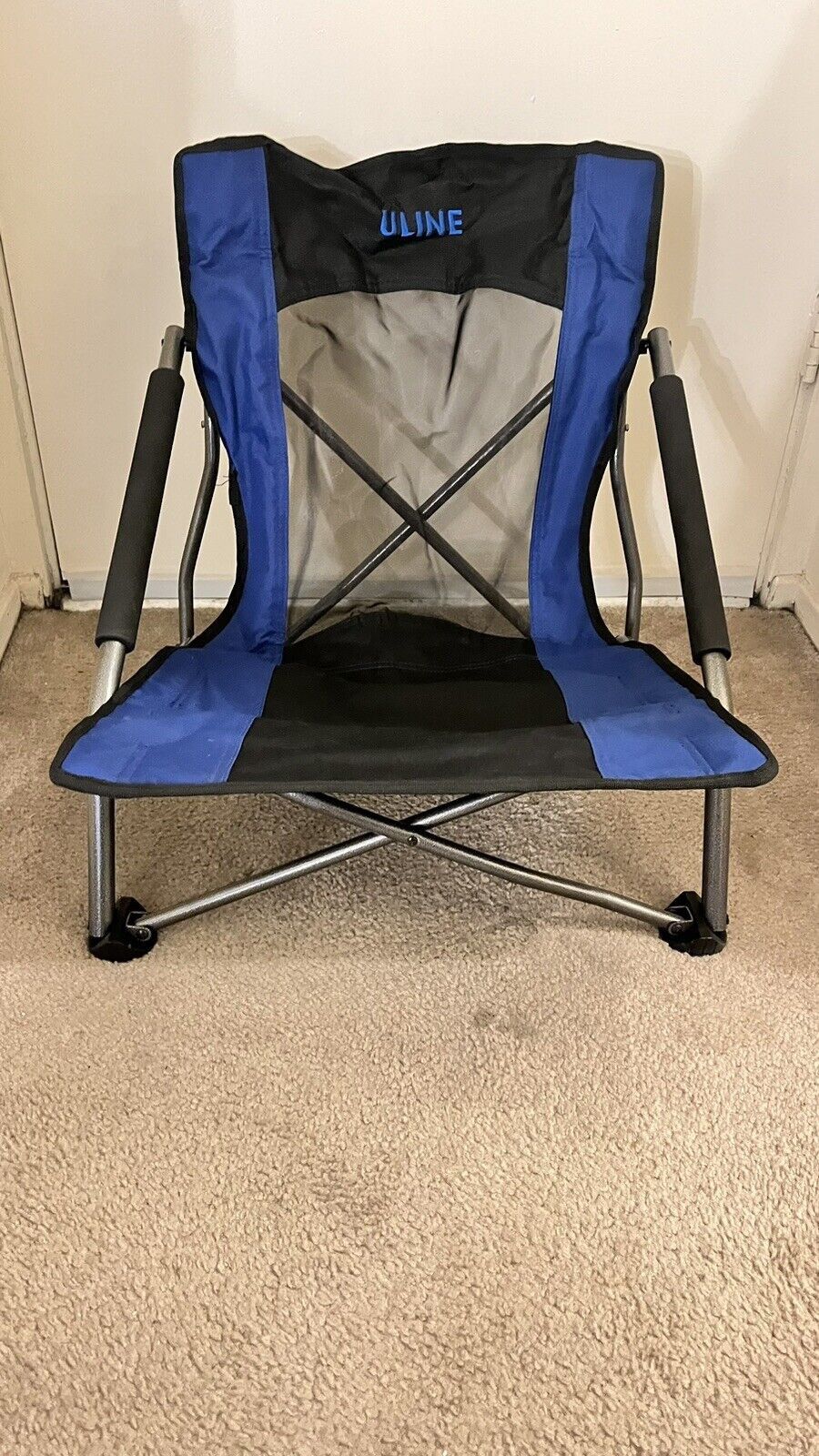 Compact folding chair, blue and black, mesh