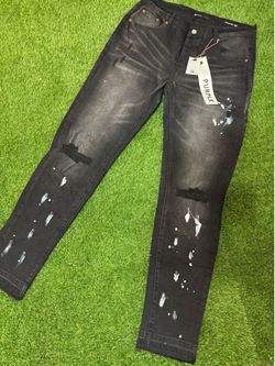 Black distressed jeans with white paint splatter design