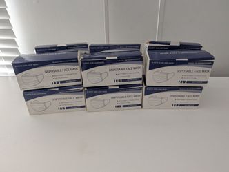 12 boxes of 50 disposable, 3-ply protective face masks featuring elastic ear loops.