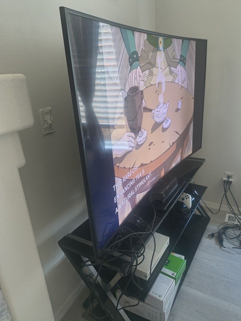 Samsung UHD 65 inch curve TV with TV stand ( Rotating) It includes XBOX 1 with 2 remote and Kinect and connecting wire