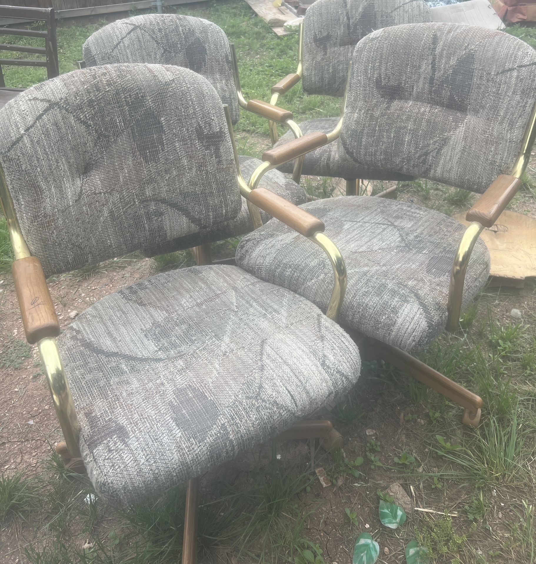 a set of 4 ugly dining chairs