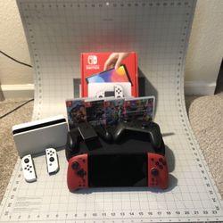 LIKE NEW! Nintendo Switch OLED + 4 games + controllers bundle
