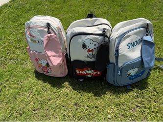 Snoopy backpacks in black, pink, and blue