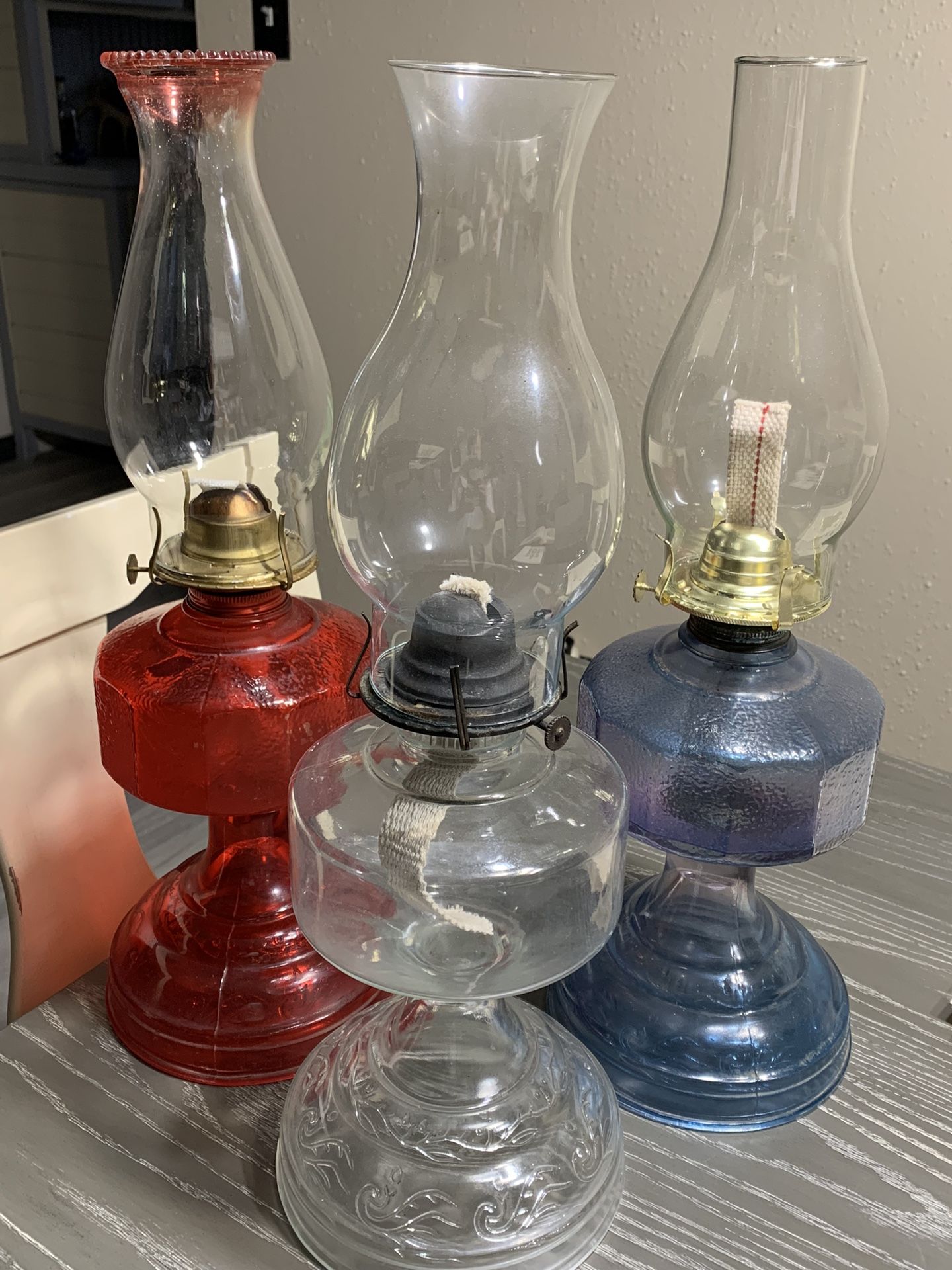 Old Red, White, and Blue Kerosene Lamps