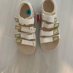 Nike Women's Icon Classic sandals in a white/sanddrift colorway. 