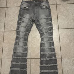gray distressed flared jeans 