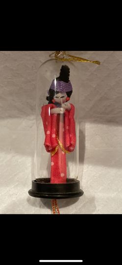 Oriental Doll In Glass