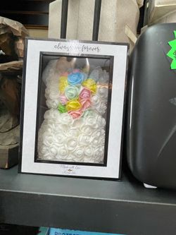 Small bear with artificial flowers