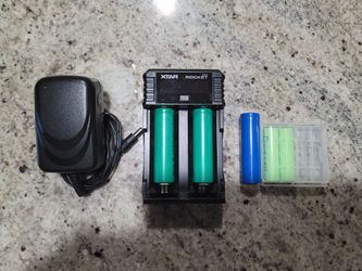 Xtar Rocket SV2 Universal Battery charger with 3× 18650 batteries and 2× AA batteries