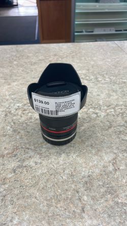 Rokinon 12mm 1:2.0 NCS wide angle lens for Cannon EF-M mount w/hood and covers.