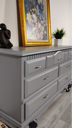Gray wood dresser with silver handles