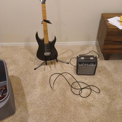Electric Guitar With Stand, Amp, And Cord