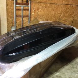 Rooftop storage container for a car or SUV