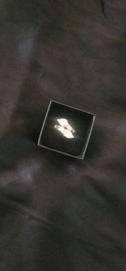 Gold ring with clear stones