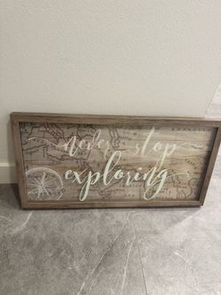 “Never Stop Exploring” wall decoration