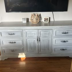 Distressed wood dresser with nine drawers