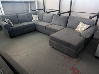 Large Gray Fabric Sectional Sofa with Three Accent Pillows