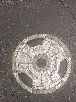 Pair of 35lb champion barbell cast iron grip plate