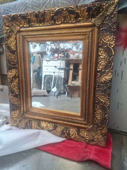 Beautiful wall hanging mirror with trim