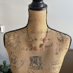 Wooden floral button necklace.