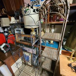 Three different 5' tall plant stands $50 ea. Four tiers, metal, shelves can fold up for moving. 