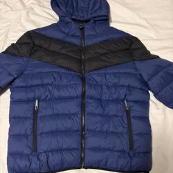 GUESS Men's Color-Block Puffer Jacket in blue and black.