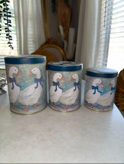 Vintage Set of 3 tin canisters with geese & blue bows motif