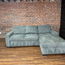 Delivery Available Kendale sleeper sofa with storage chaise retails 1300