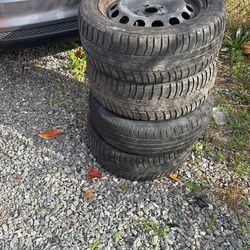 Four tires And A Spare Tire