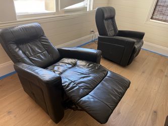 Black leather electric recliners.