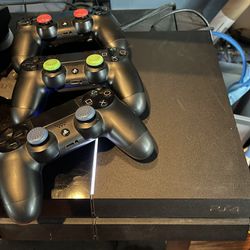 PS4 with Controllers & Games
