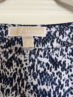It’s A Beautiful Blouse From Michael Kors The Color Is White And Navy Blue. The Size Is Medium.