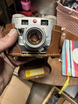 vintage Kodak Signet 35 rangefinder film camera with its original leather field case. 