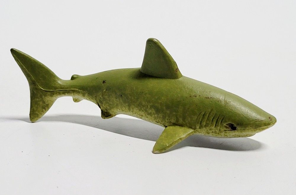 Unbranded 6" Lemon Shark Ocean Animal Realistic Detailed Plastic Action Figure. The toy in the image is a lemon shark. Explanation: Coloration: Lemon