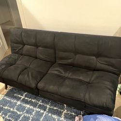 Black Futon Sofa Bed With Foldable Arm Rests And Back