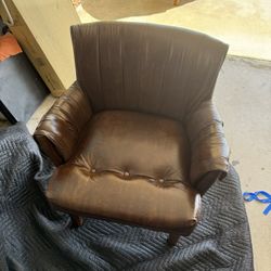Leather Chairs: vintage brown leather club chair featuring a tufted seat