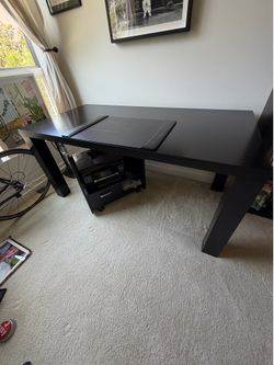 Black office desk with sliding printer holder and chair