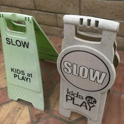 “ slow : kids at play “ signs $6 each when buy BOTH for $12 - must come to Huntington Beach