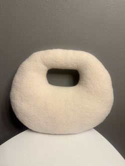 Pillow with arm hole